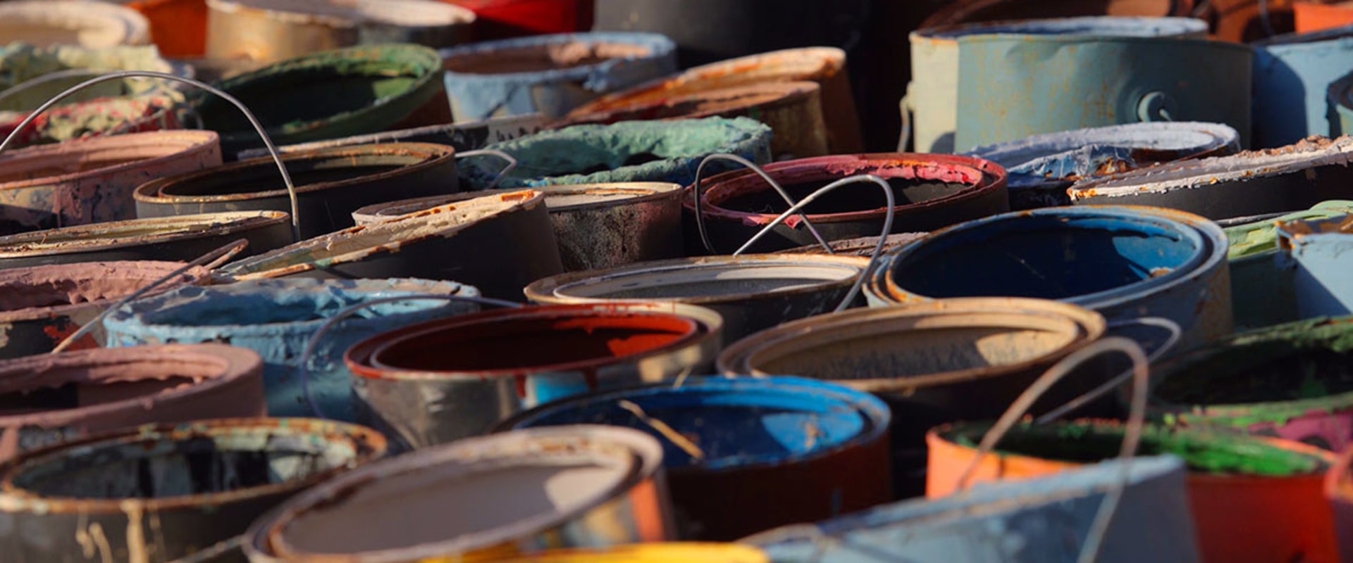 Can i put paint cans in a dumpster?